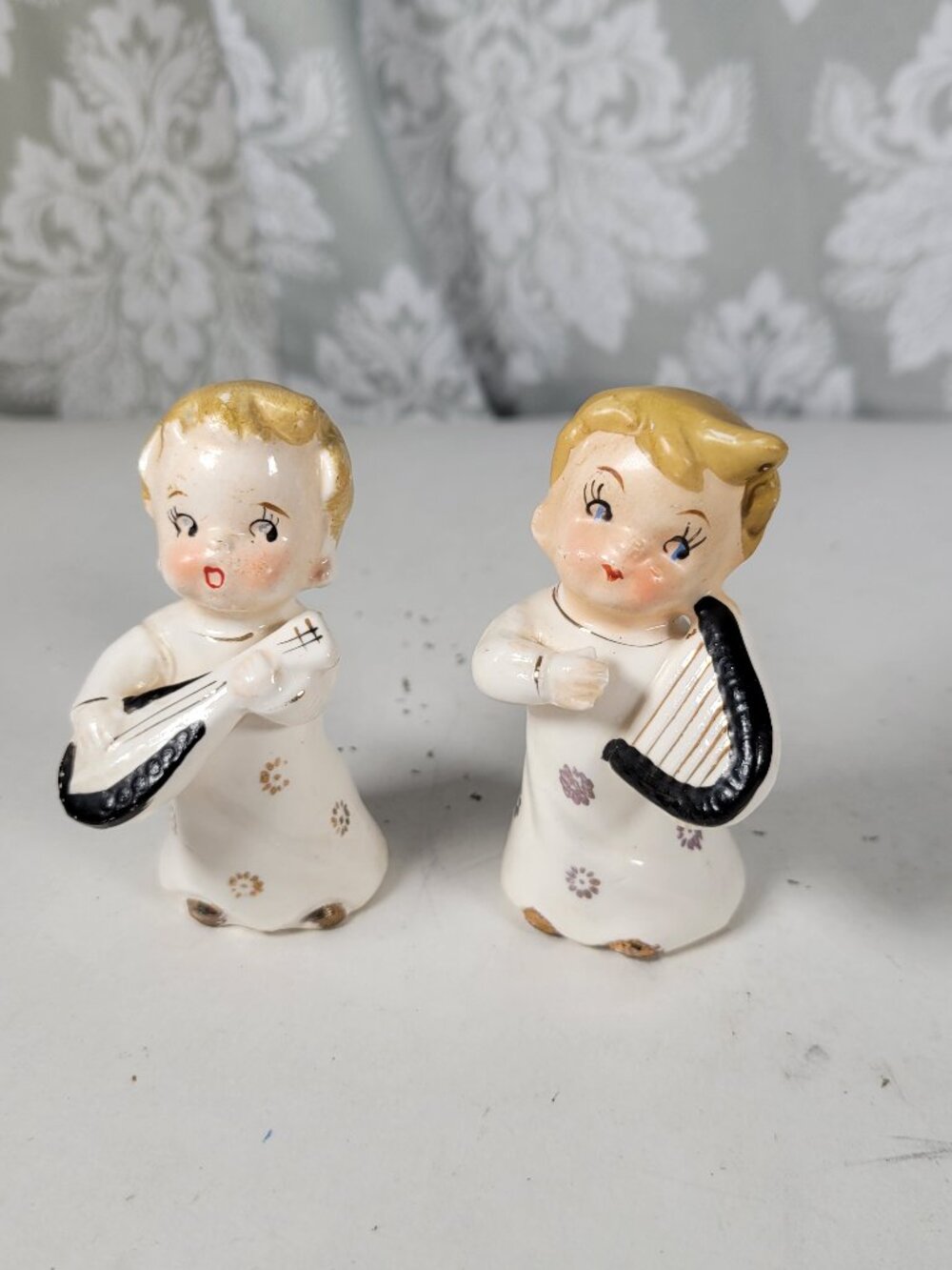 Two Kitschy Xma vintage musical boy angel figurines - gold gilded lute & harp